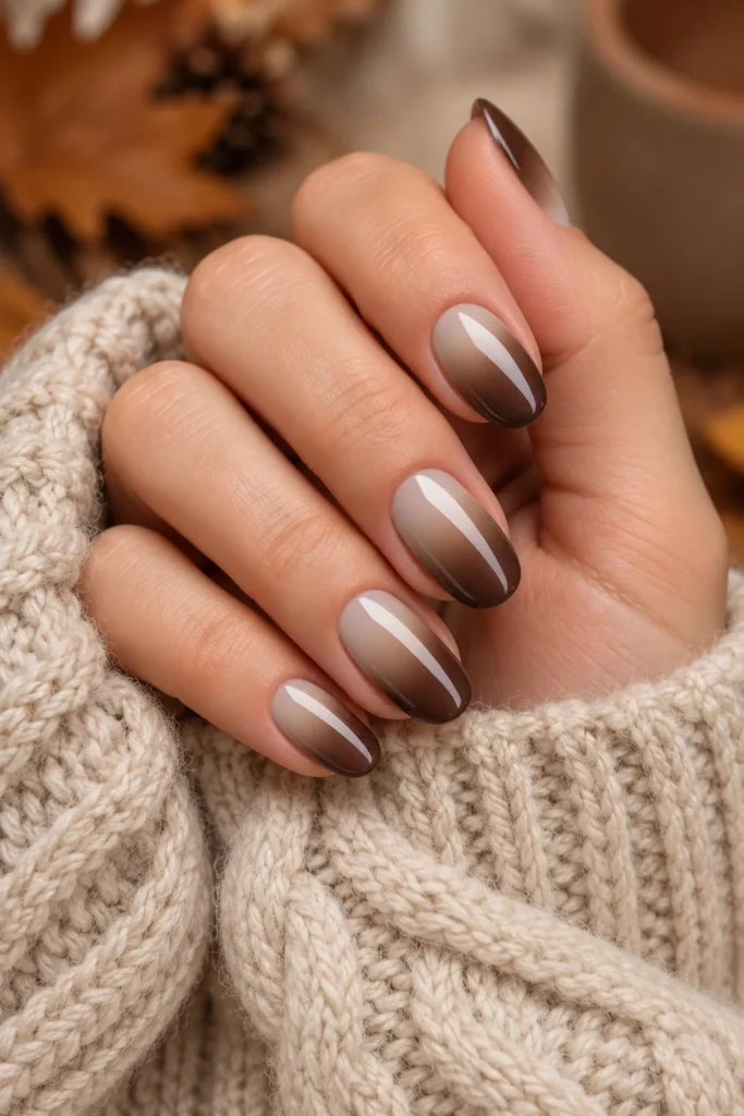 Almond nails with a soft beige-to-mocha brown ombre gradient